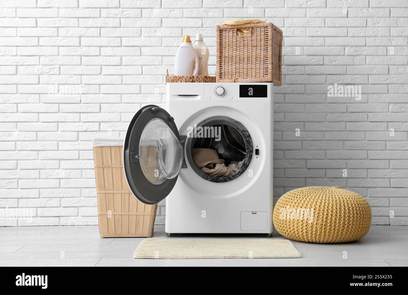 Washing machine with black mold and clothes in laundry room Stock Photo