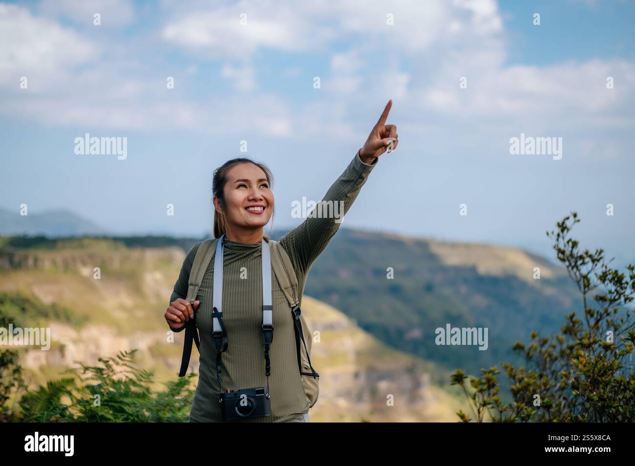 Woman hiking on rocky jungle hi-res stock photography and images - Alamy
