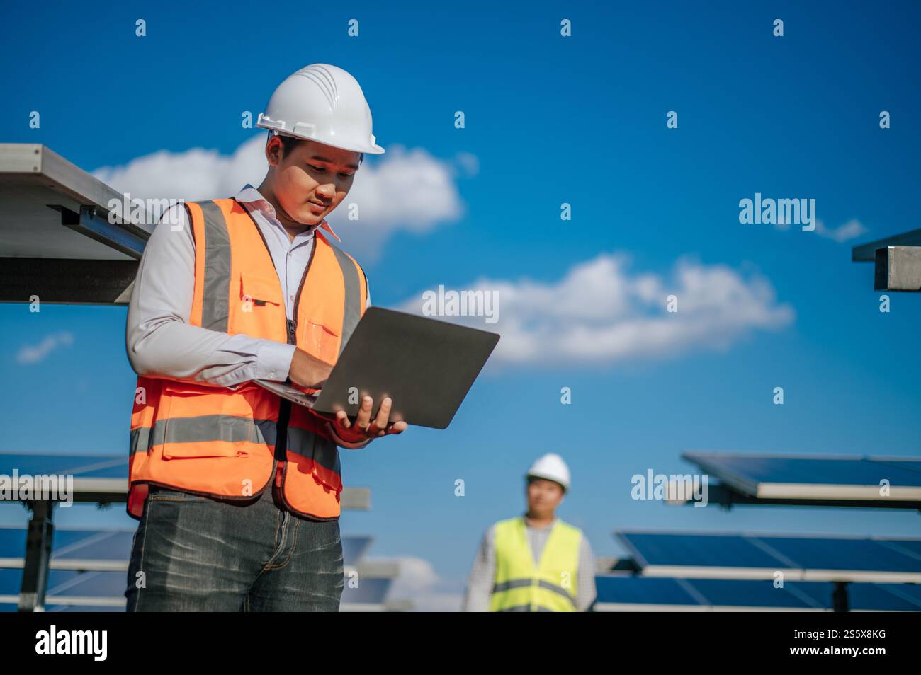 Selective focus, Young Asian technician man in safety uniform and ...