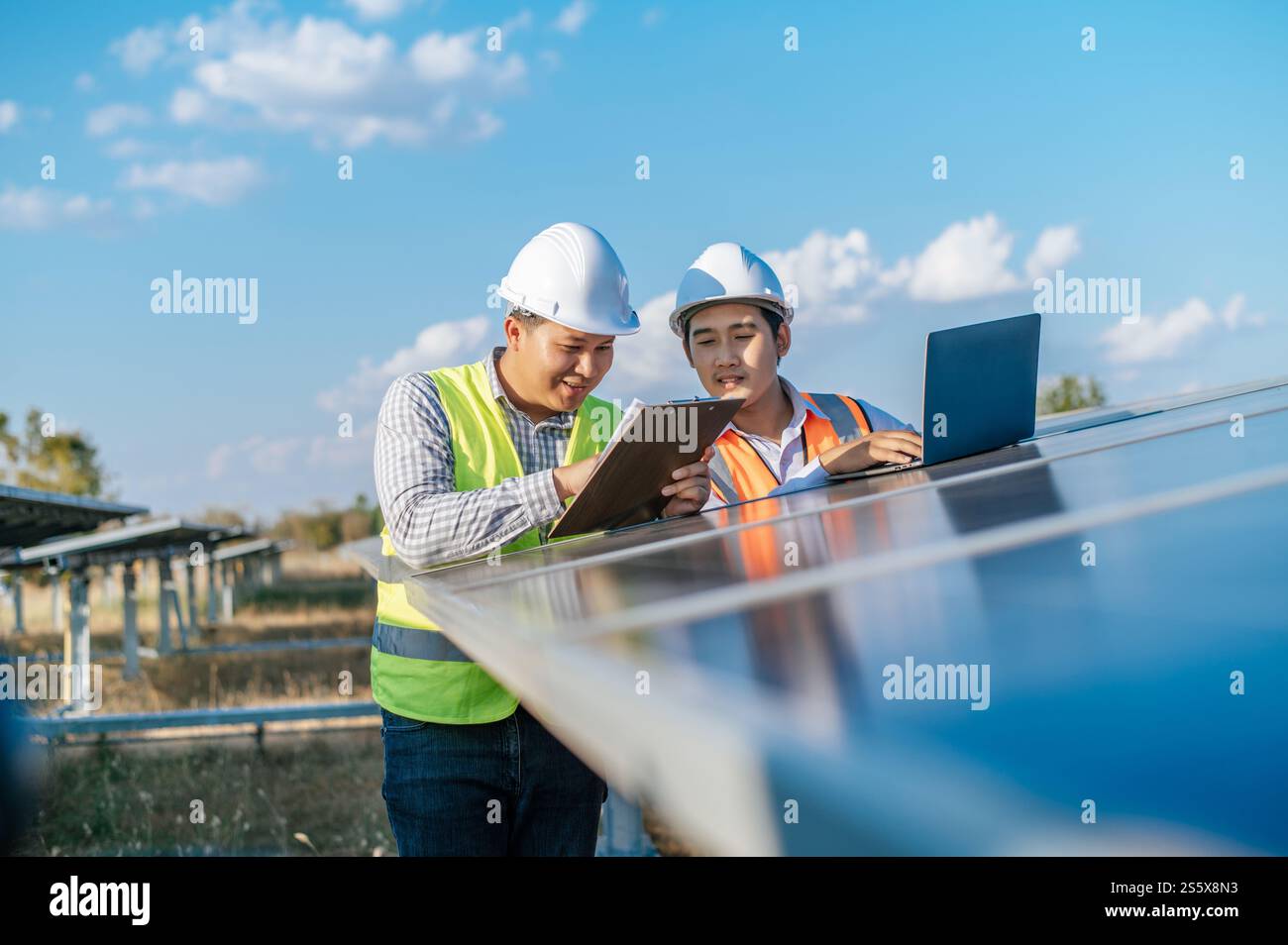 Engineering Check Efficiency Issue Asian Inspector Engineer man and young technician man use laptop ...