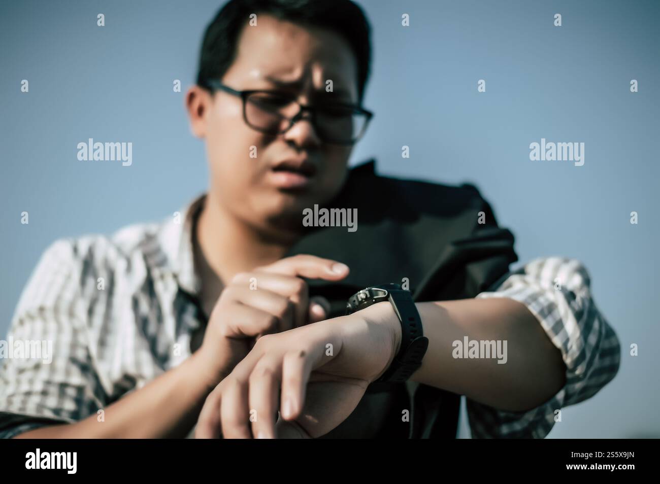 Close up and selective focu,s, Young Asian Businessman wearing shirt and tie with shorts and eyeglasses with problems and stress or disappointment of Stock Photo