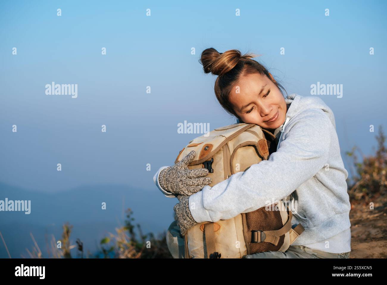 Woman on mountain cliff hi-res stock photography and images - Alamy