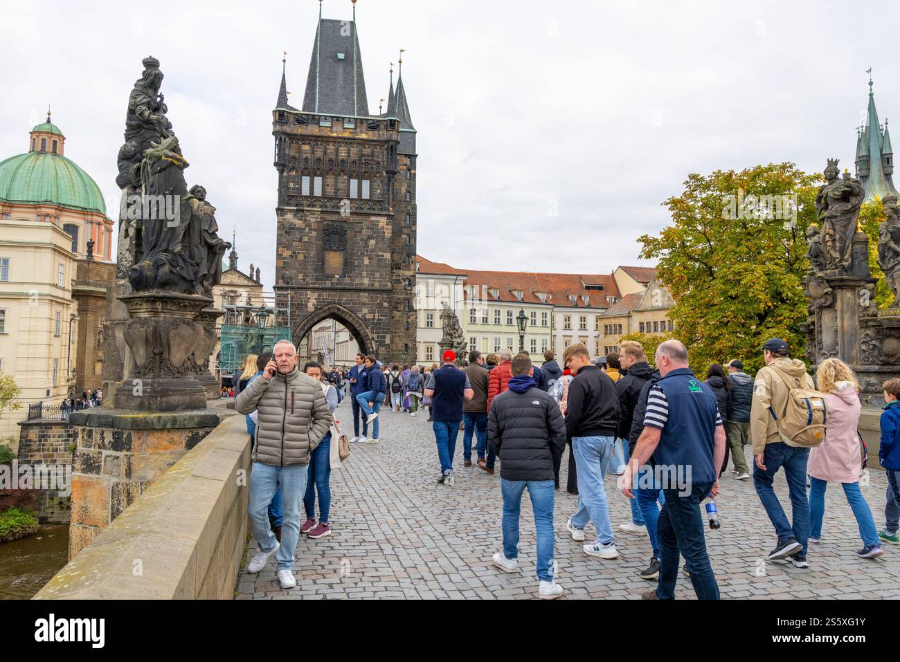 Tourists in Prague city centre walking across the historic medieval Charles Bridge, Czech Republic,Europe,2024 Stock Photo