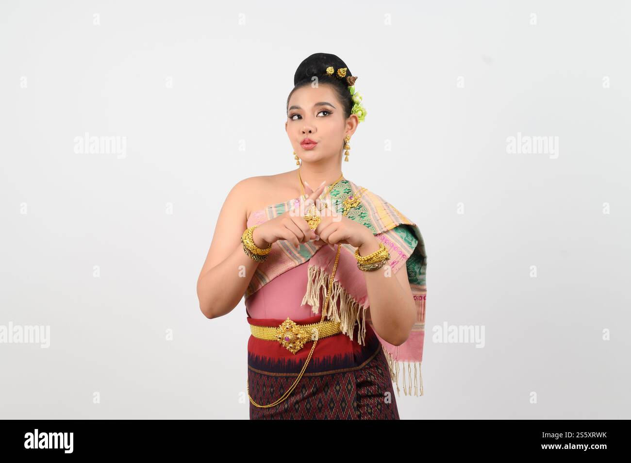 Portrait Young beautiful woman in northeastern dress, she raising fingers in a cross to reject with feel upset on white background, copy space Stock Photo