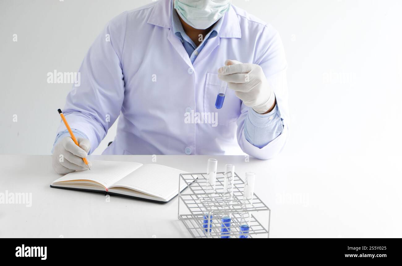 Science innovative Male medical or scientific laboratory researcher performs tests with liquid in laboratory. equipment science experiments Stock Photo