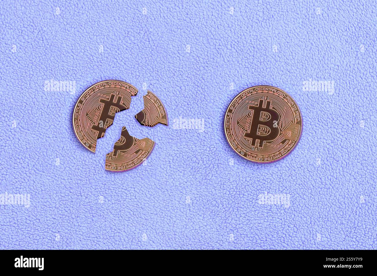 Broken into pieces bitcoin lying on a pink fleece fabric background. The  fall and collapse of the course of crypto currency. Bad news for  cryptocurren Stock Photo - Alamy