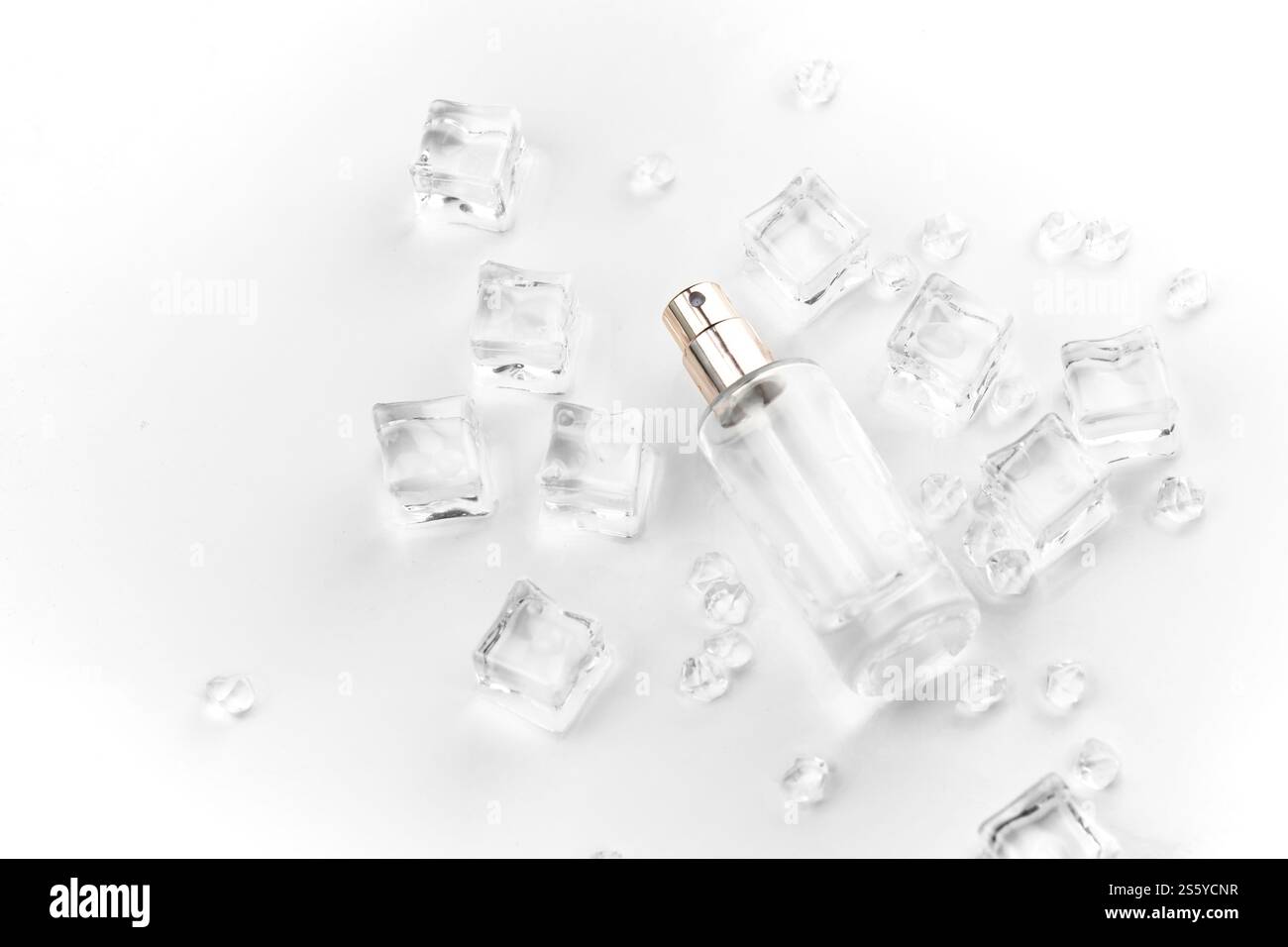 Female perfume bottle, objective photograph of perfume bottle in ice ...