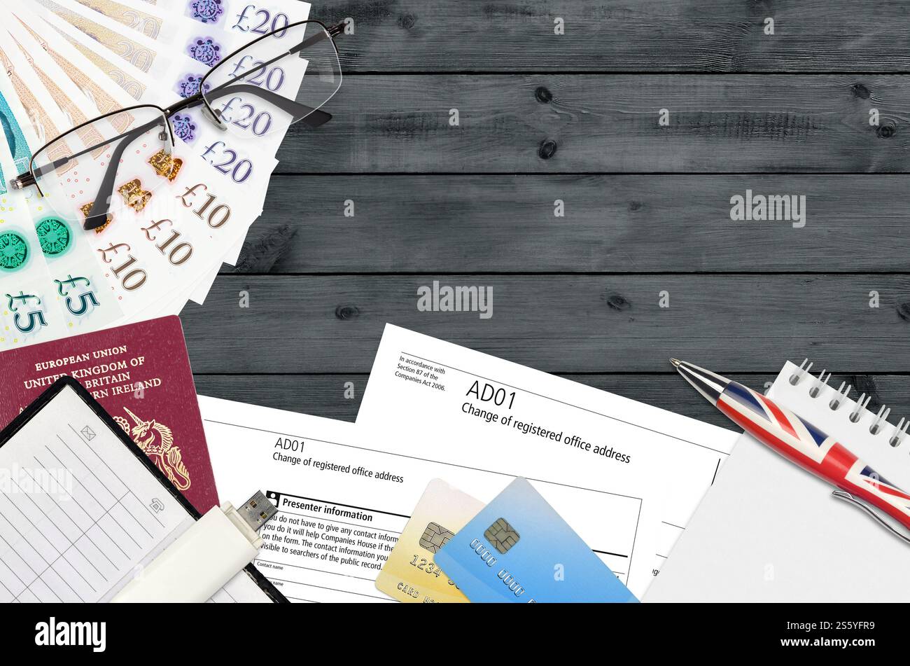 English form AD01 Change of registered office address from Companies House service lies on table with office items. CH business and paperwork process Stock Photo