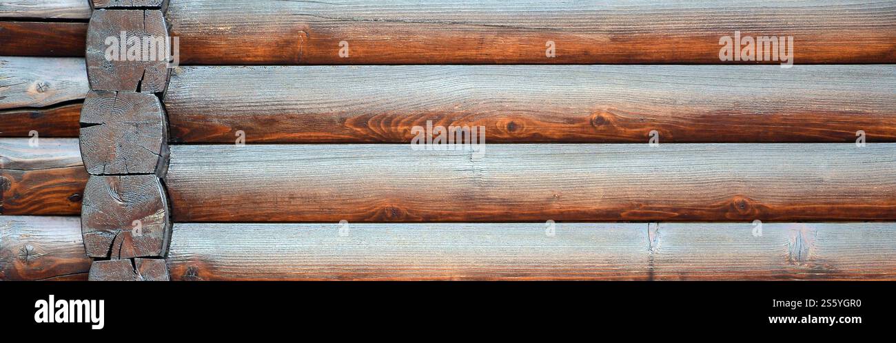 Hewn timber. Rustic log wall horizontal timber background. Fragment of ...