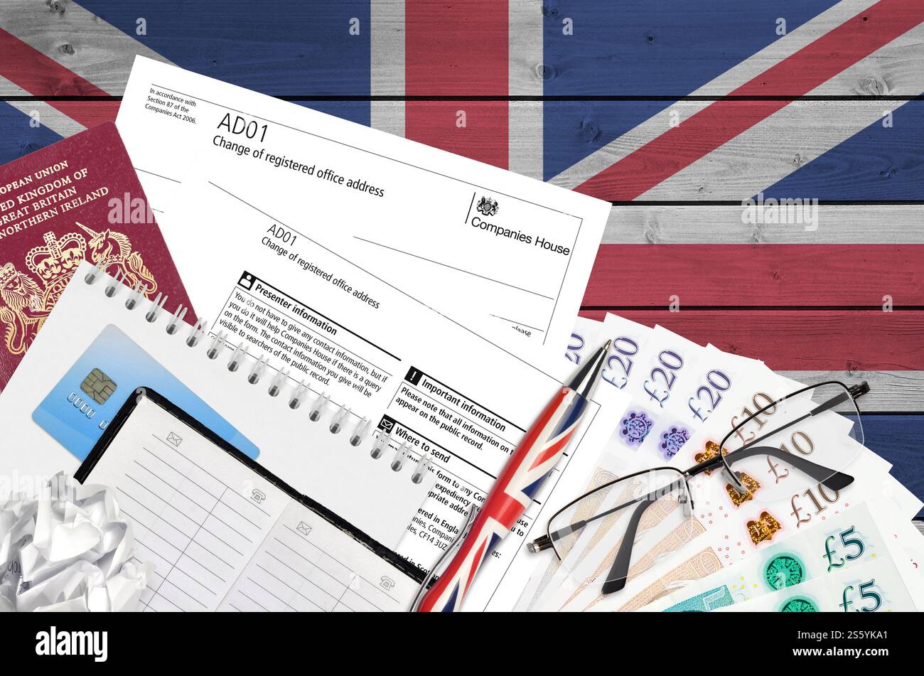 English form AD01 Change of registered office address from Companies House service lies on table with office items. CH business and paperwork process Stock Photo