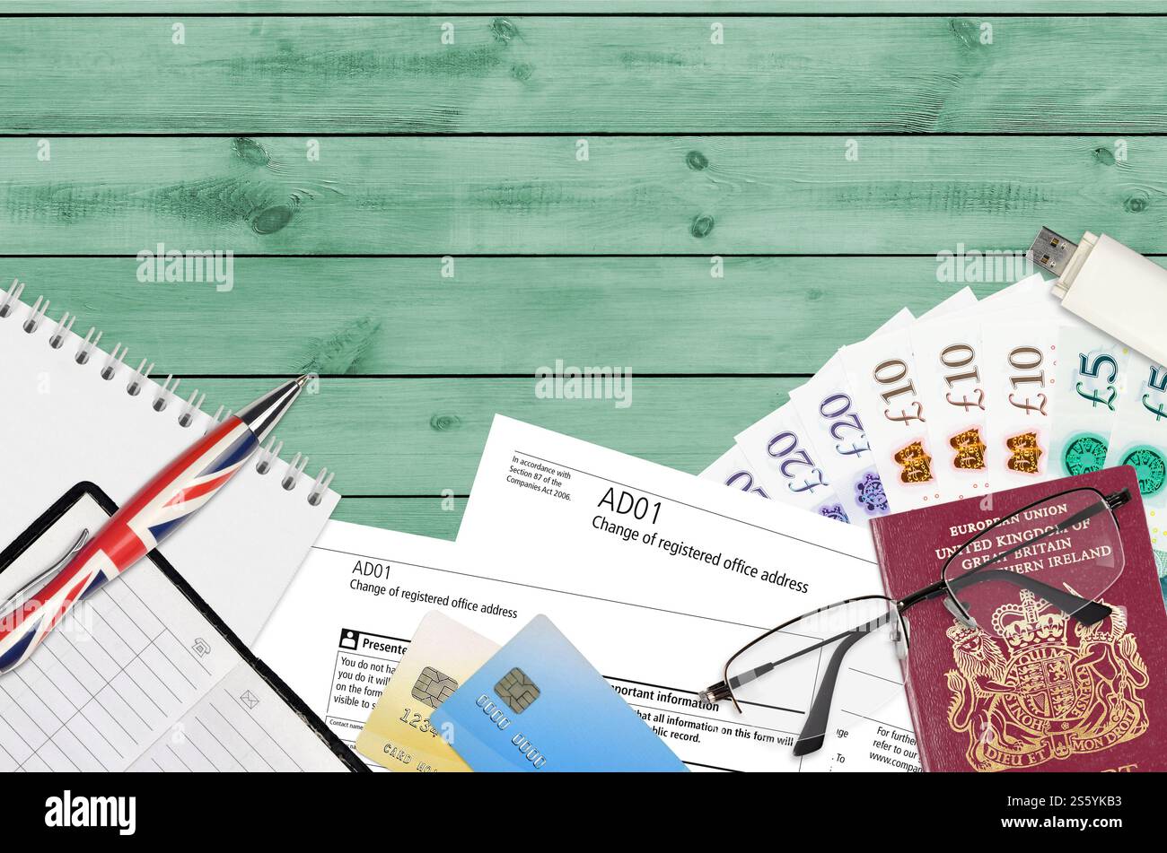 English form AD01 Change of registered office address from Companies House service lies on table with office items. CH business and paperwork process Stock Photo