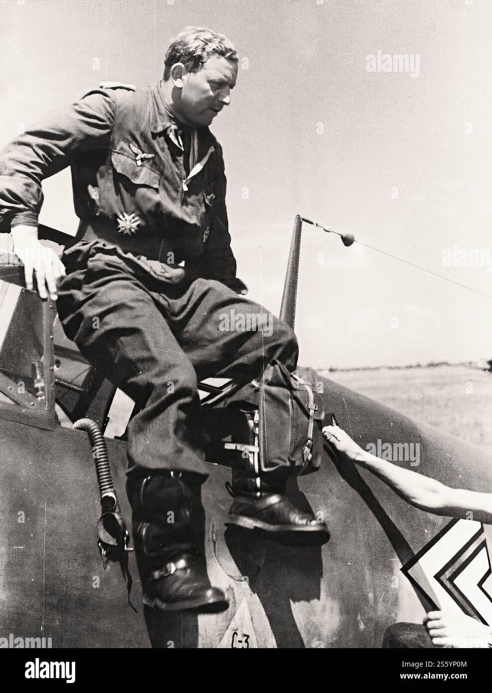 Hauptmann Walter Oesau (III.JG3 CO) out of the cockpit of his fighter ...