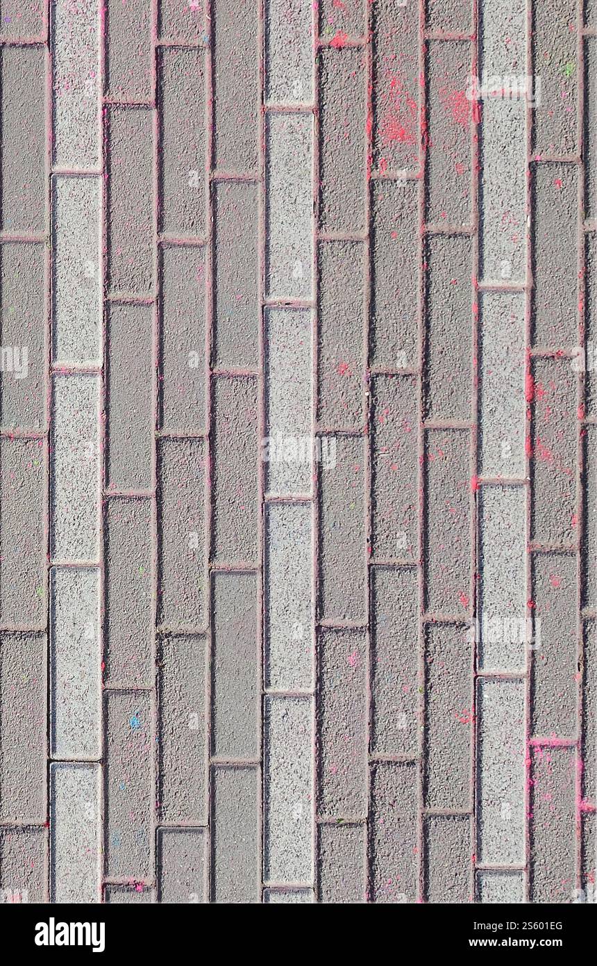 Multi colored earth, paving slabs, powder coated with dry colors at the Holi festival close up. Multi colored paving slabs, powder coated with dry Stock Photo