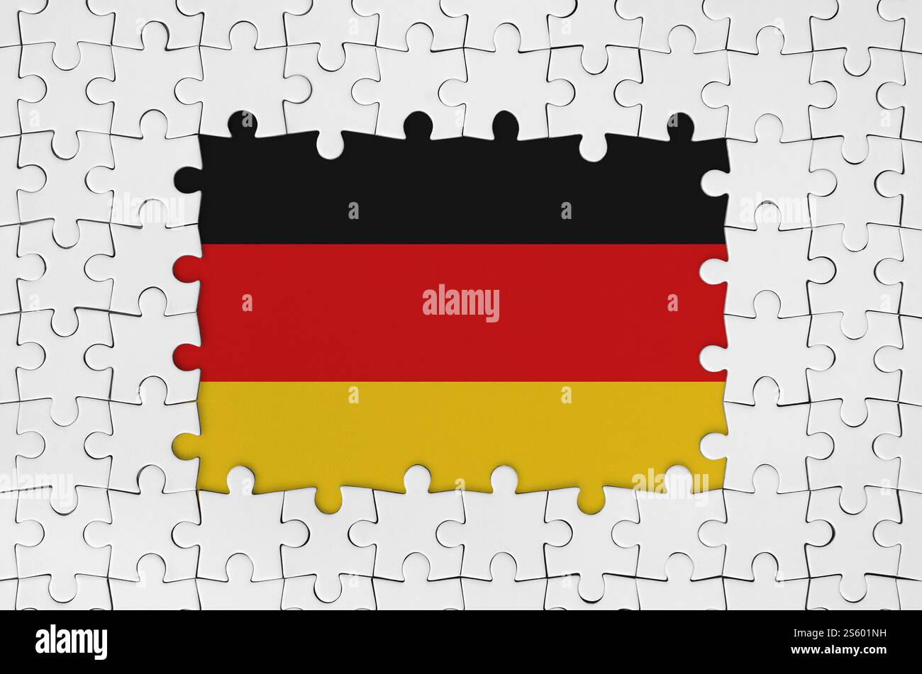 Germany flag in frame of white puzzle pieces with missing central parts