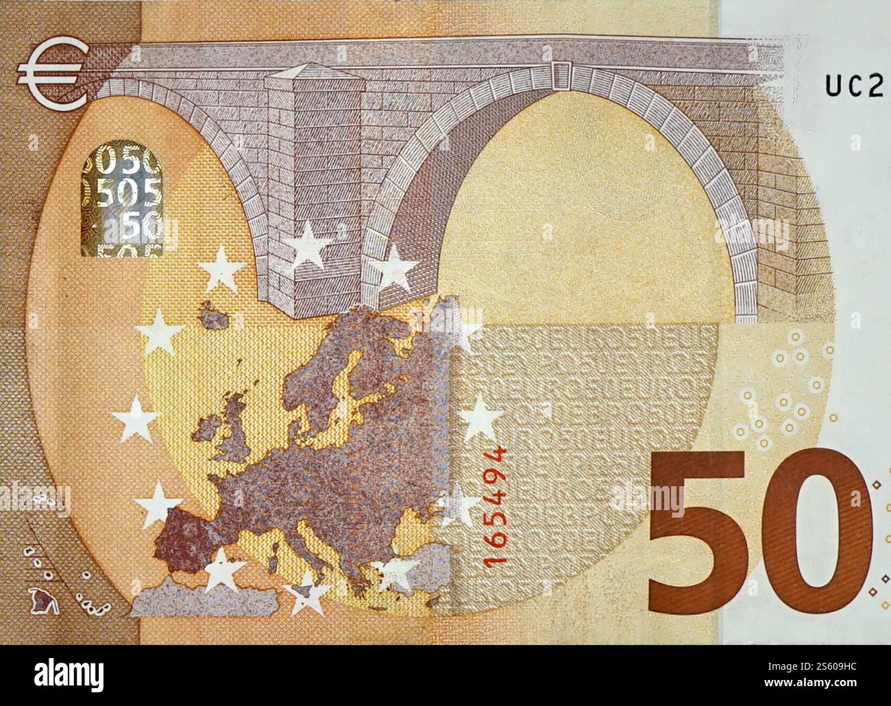 Fragment part of 50 euro banknote close-up with small brown details ...