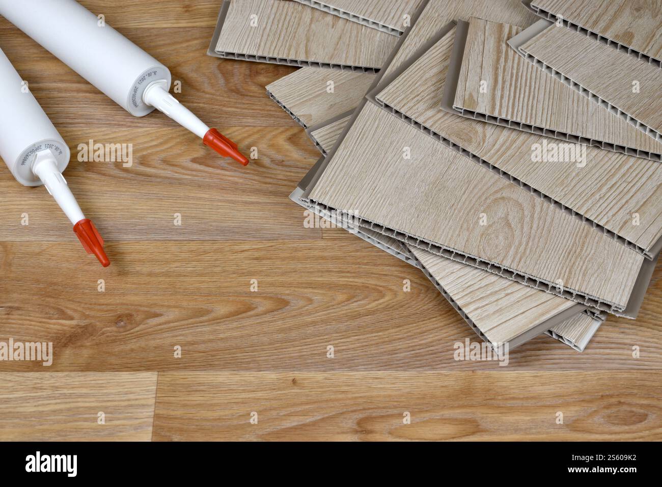 Set of items for PVC ceiling indoor works. Assembly adhesive bottles ...