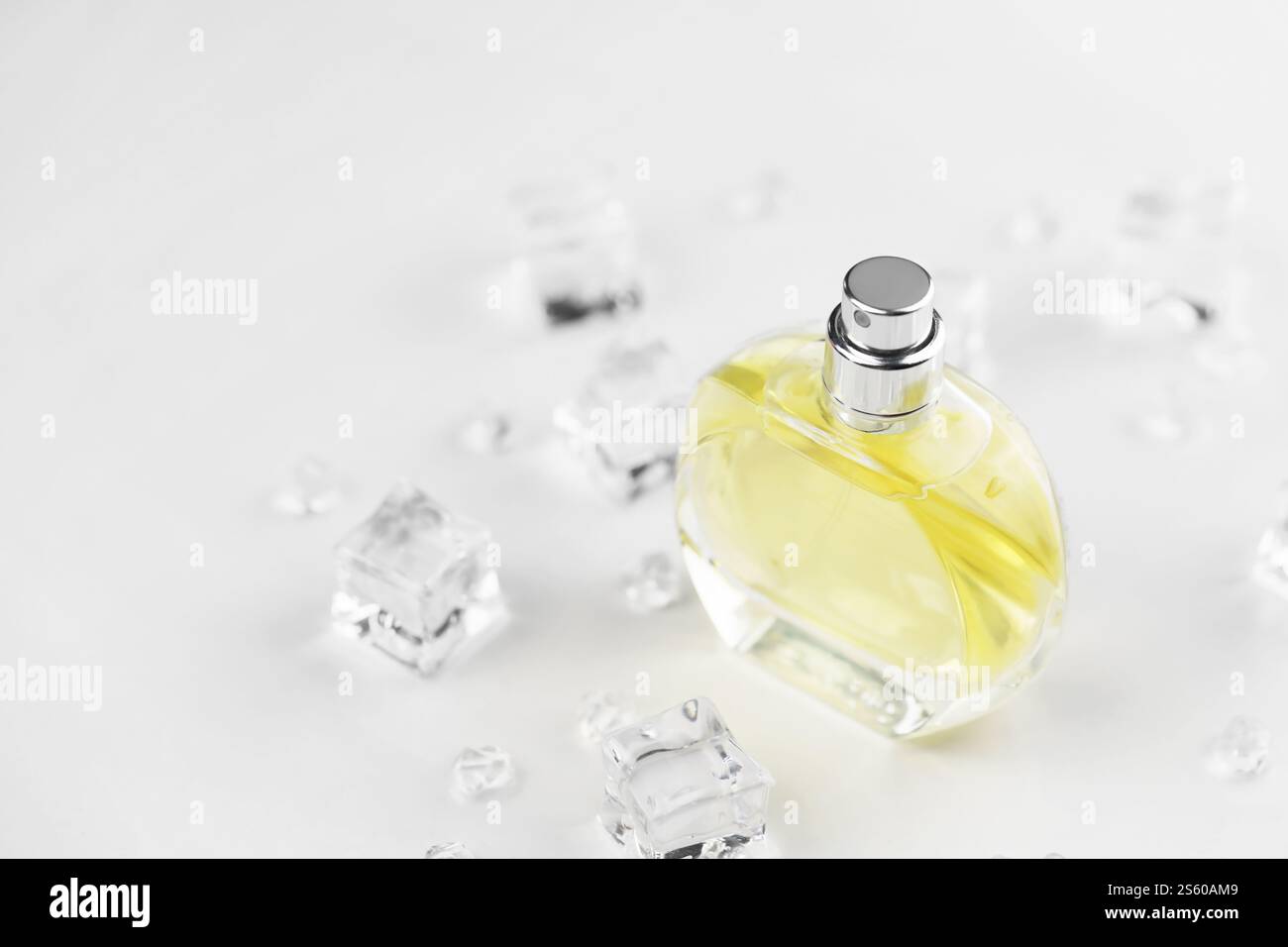 Female perfume yellow bottle, Objective photograph of perfume bottle in ...