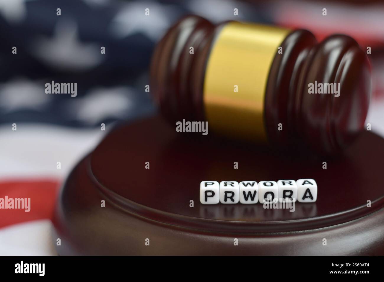 Justice mallet and PRWORA acronym close up. Personal responsibility and work opportunity reconciliation act. Justice mallet and PRWORA acronym. Stock Photo