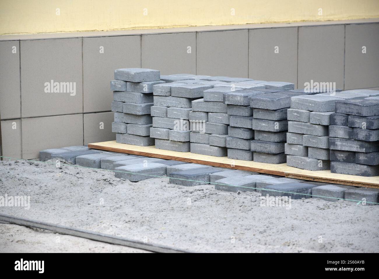 Rows of gray and dark grey walkway slab lying outdoors. Material for ...