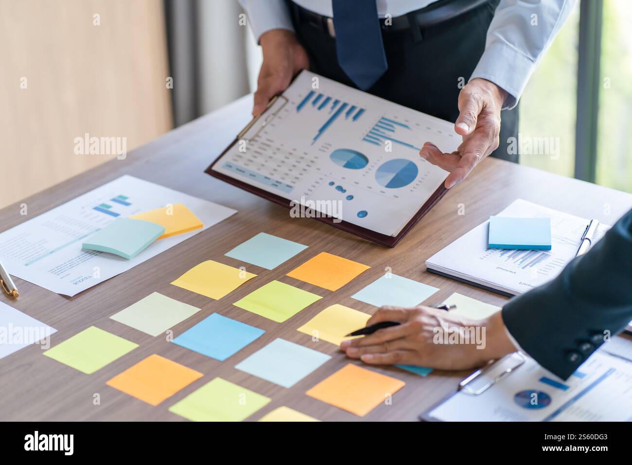 Business People brainstorming Meeting Design Ideas use post it notes to ...