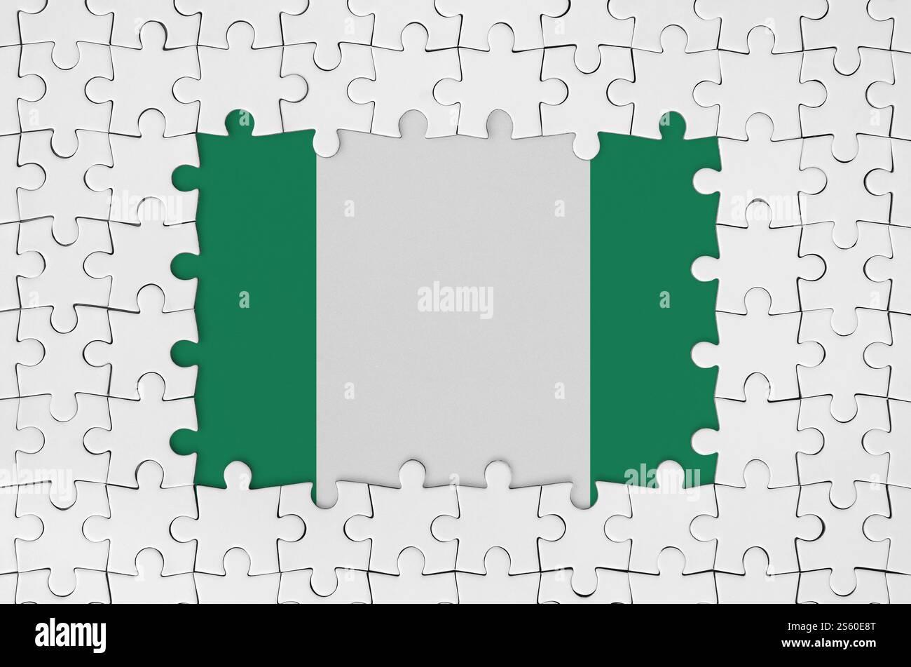 Nigeria flag in frame of white puzzle pieces with missing central parts Nigeria flag in frame of white puzzle pieces with missing central parts