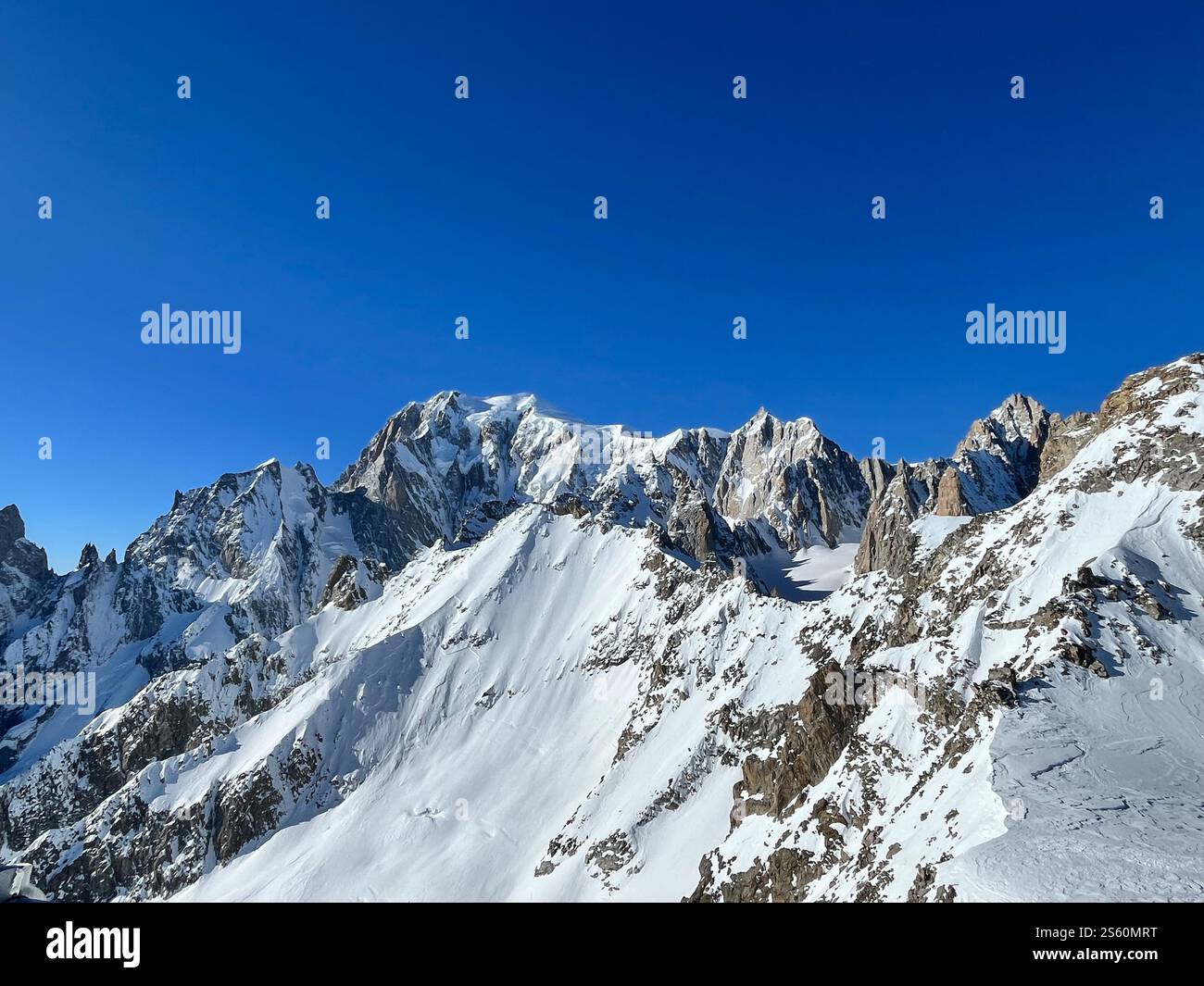 Majestic Mont Blanc massif towers over the pristine slopes of ...