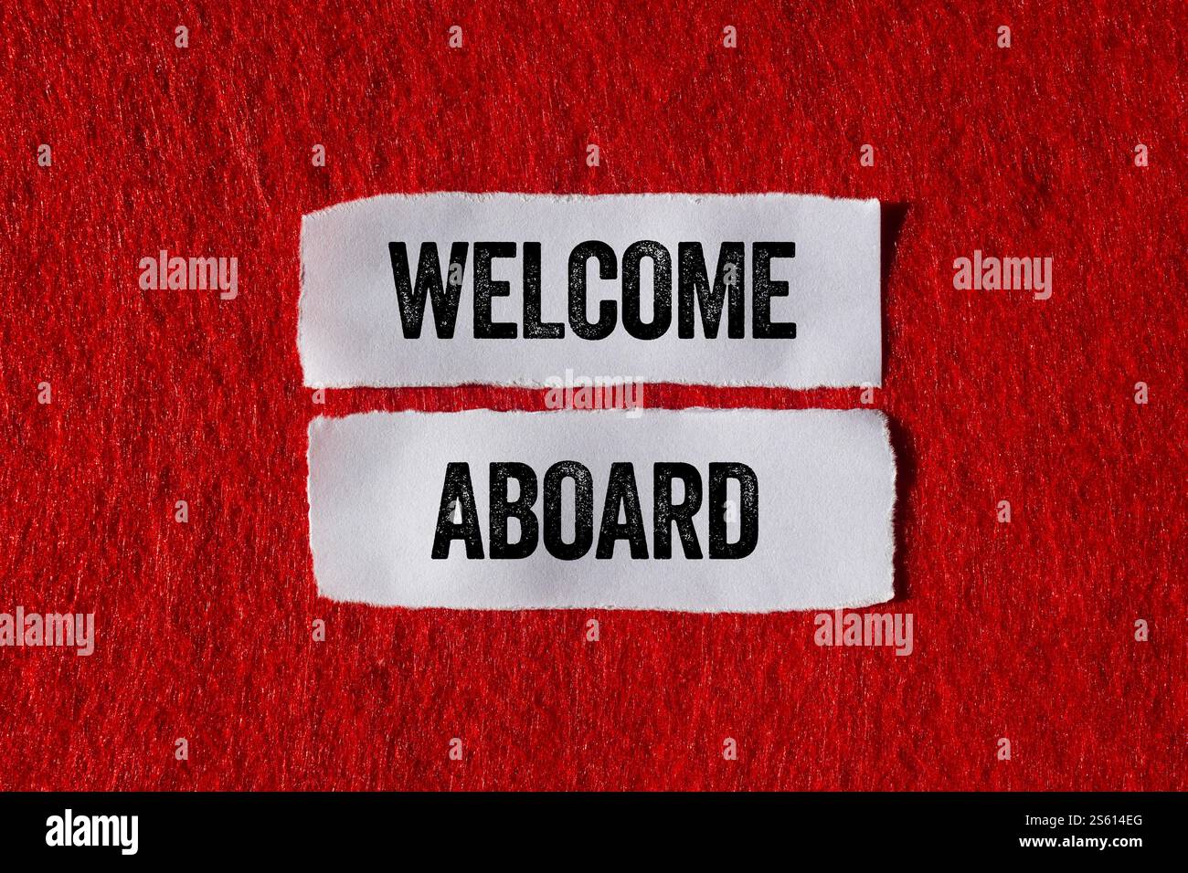 Welcome Aboard Message Written On Ripped Torn Paper Pieces On Red Welcome Aboard Message Written On Ripped Torn Paper Pieces On Red