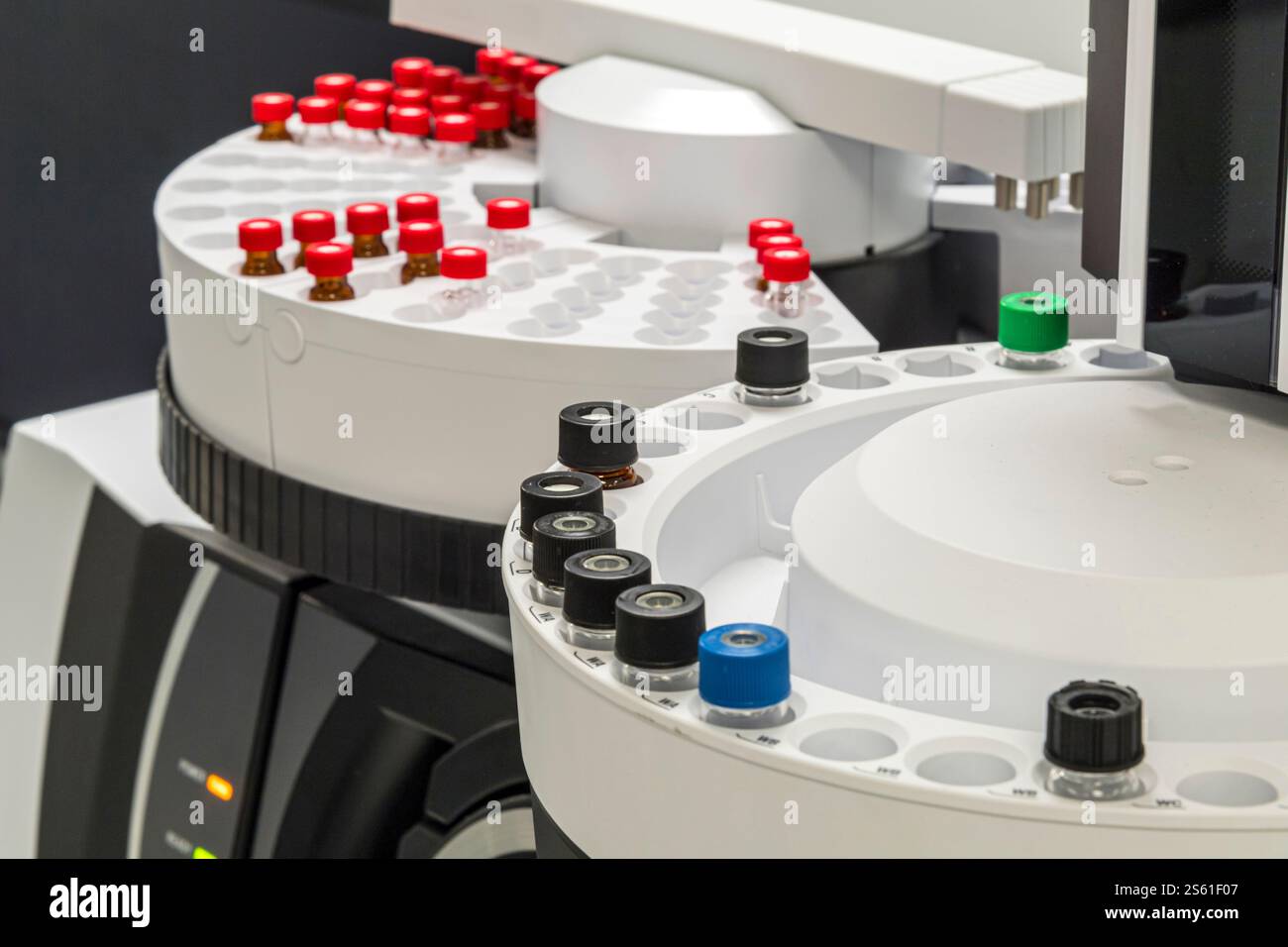 Vials in automated scientific testing equipment, USA Stock Photo