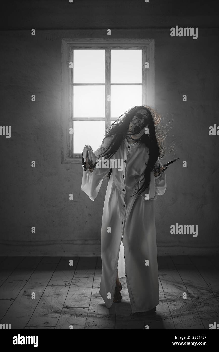 A creepy and terrifying ghost. Woman with messy black hair, in white ...