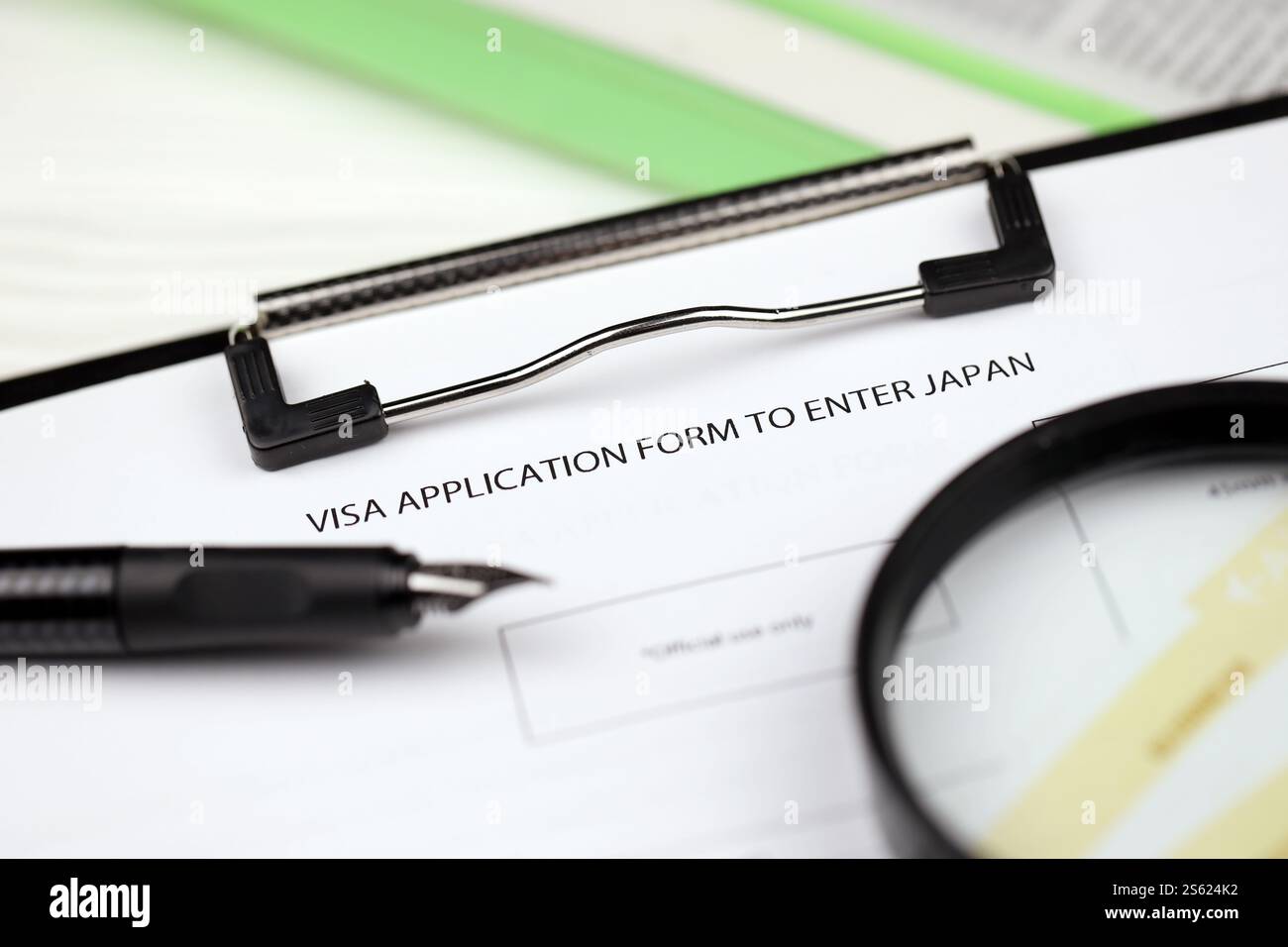 Visa application to enter Japan on A4 tablet lies on office table with ...
