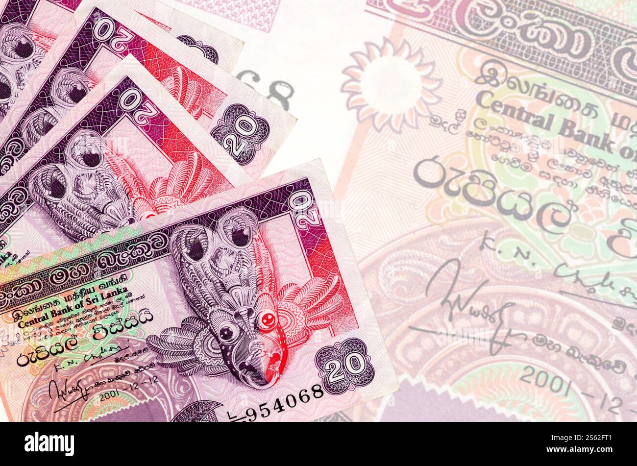 20 Sri Lankan rupees bills lies in stack on background of big semi ...