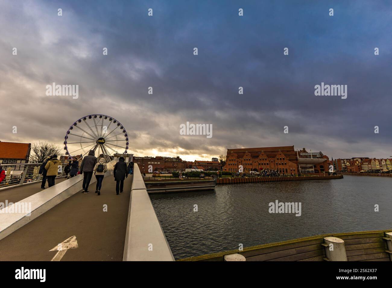 The center of the old town of Gdańsk, a walk along the Motlawa River, historic tenement houses, a market, a medieval crane Stock Photo