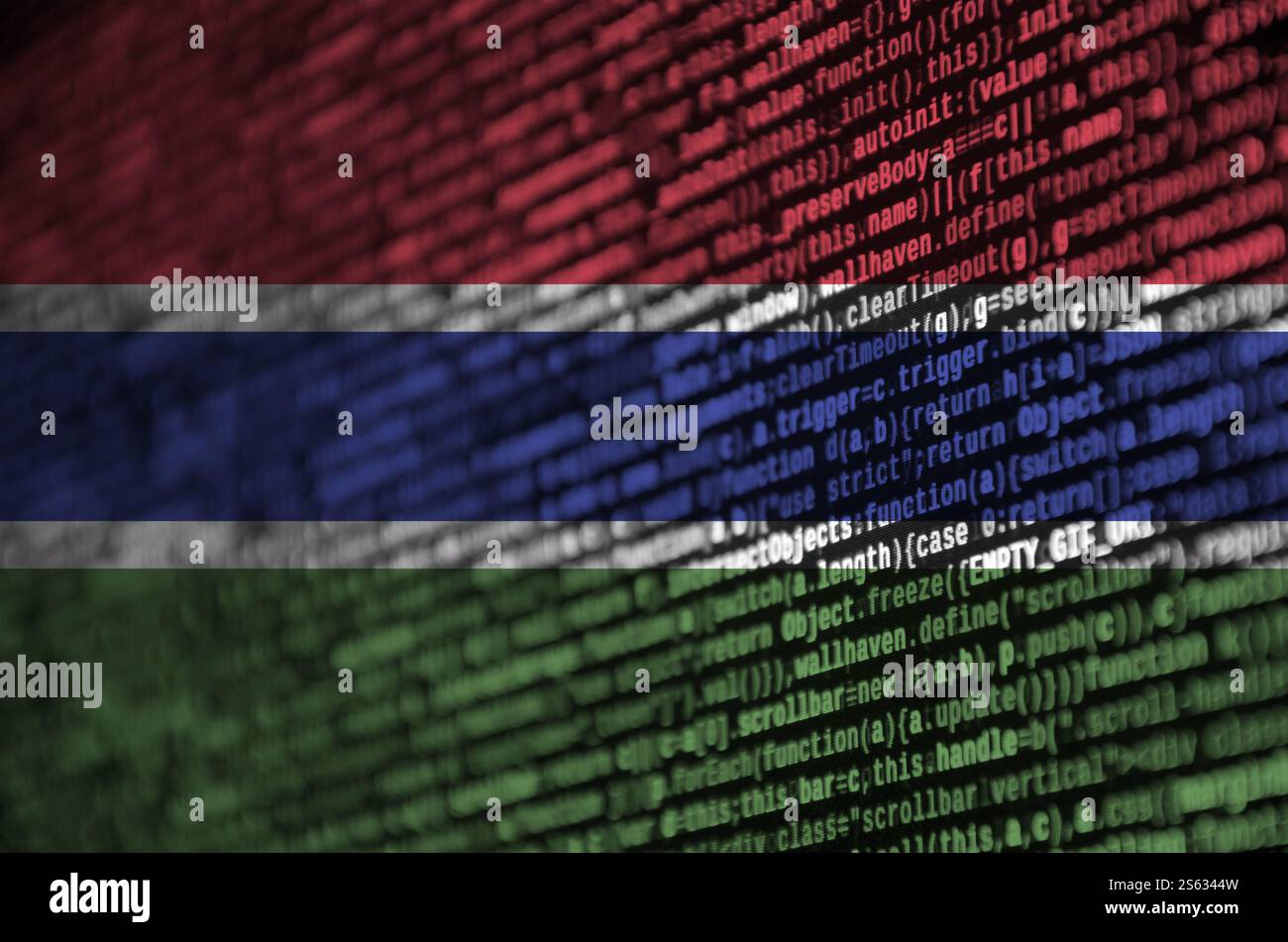 Gambia flag is depicted on the screen with the program code. The concept of modern technology and site development. Gambia flag is depicted on the Stock Photo