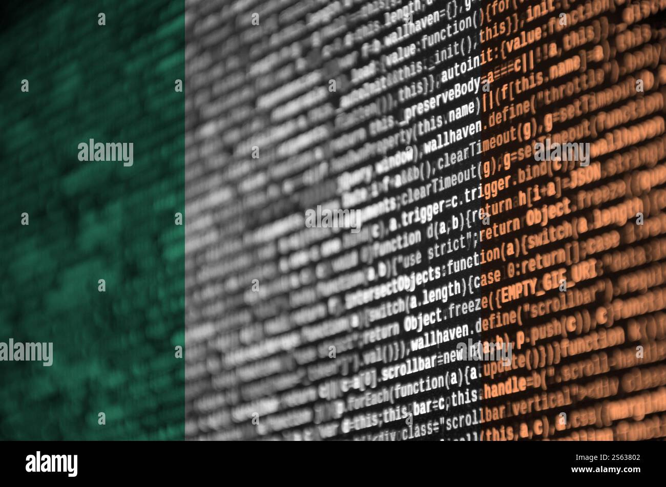 Ireland flag is depicted on the screen with the program code. The concept of modern technology and site development. Ireland flag is depicted on the Stock Photo