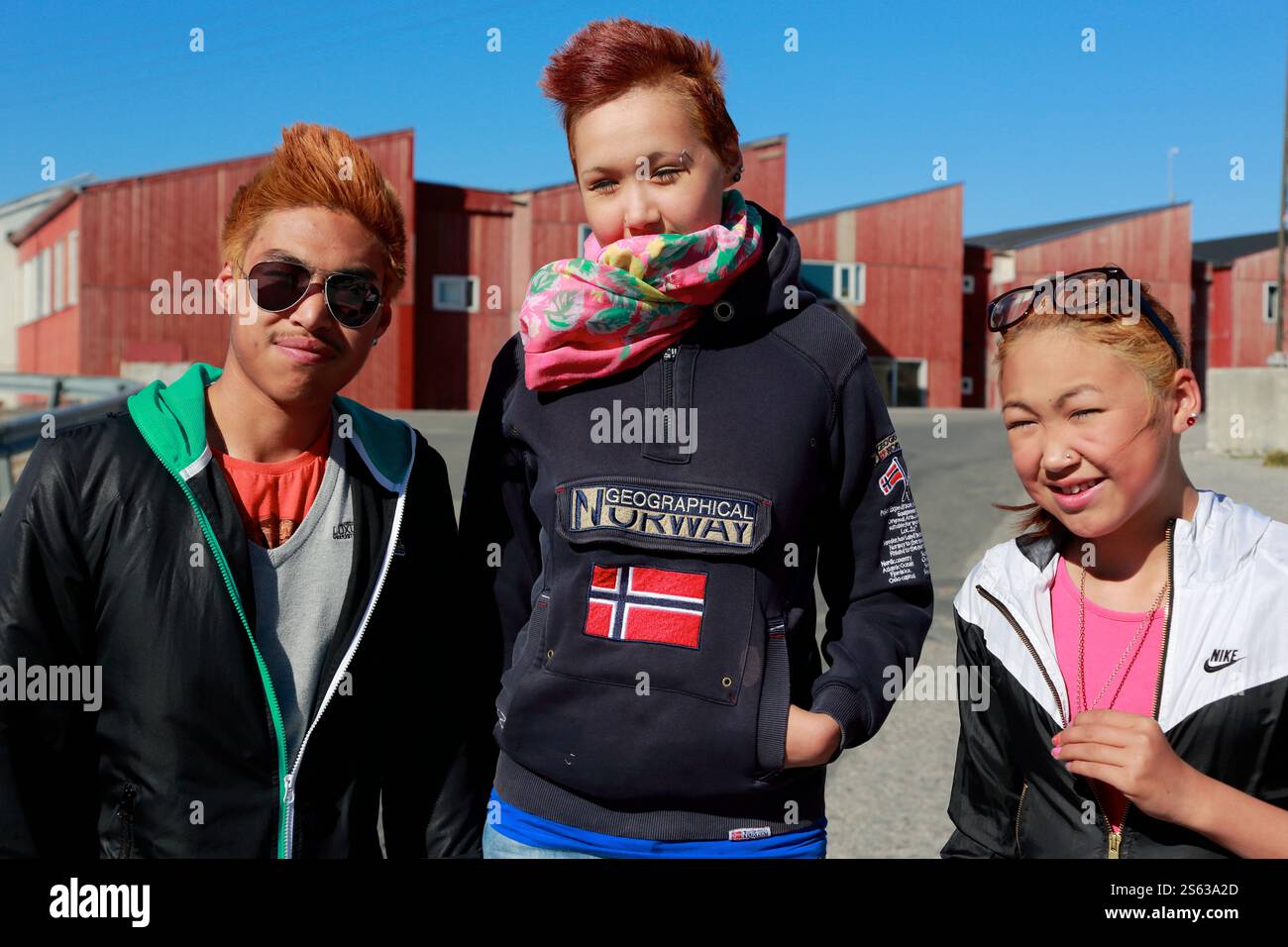 Local Inuit teenage with dyed hair posing for camera in Ilulissat.Disko ...