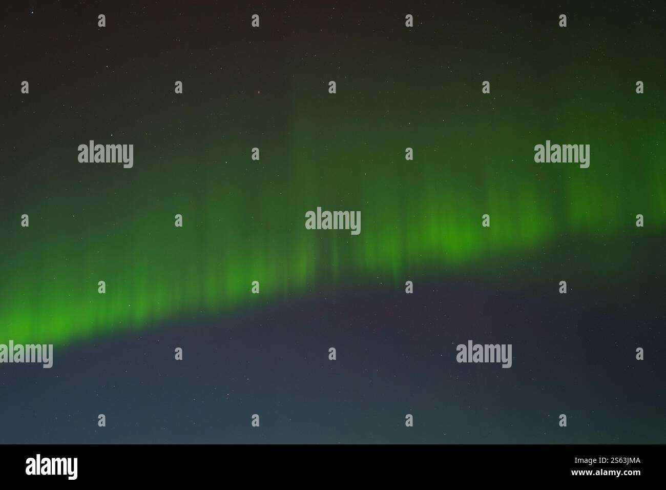Vivid green aurora borealis lighting up the night sky in Hveragerdi ...
