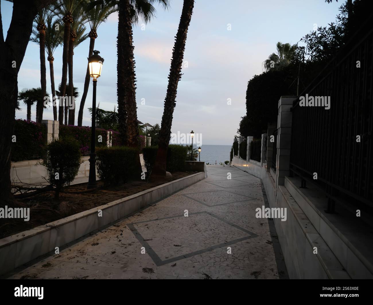 Silhouettes of Plamen in the sunset of Marbella Spain Stock Photo