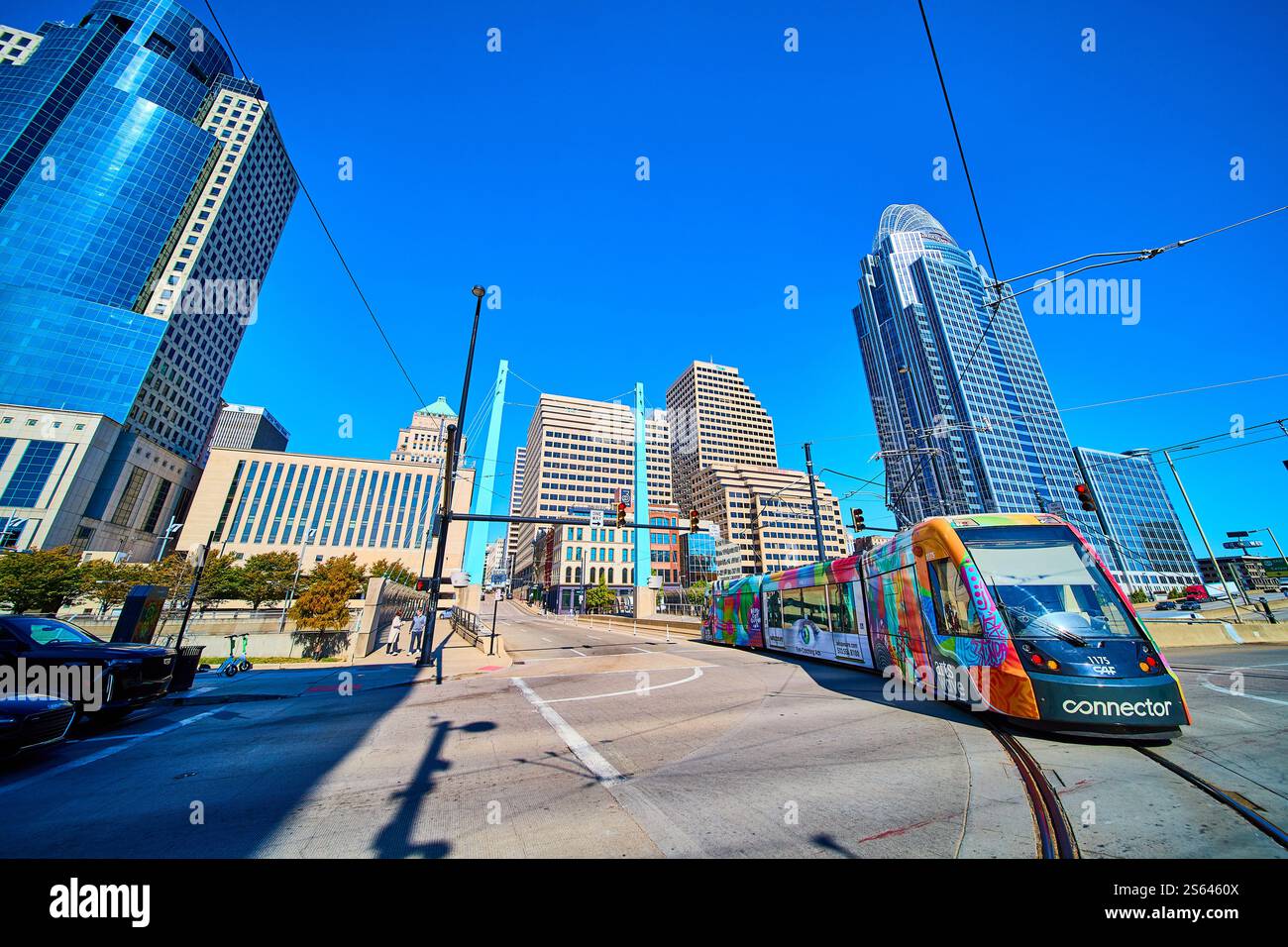 Vibrant Streetcar and Cincinnati Skyline from Street Level Perspective Stock Photo