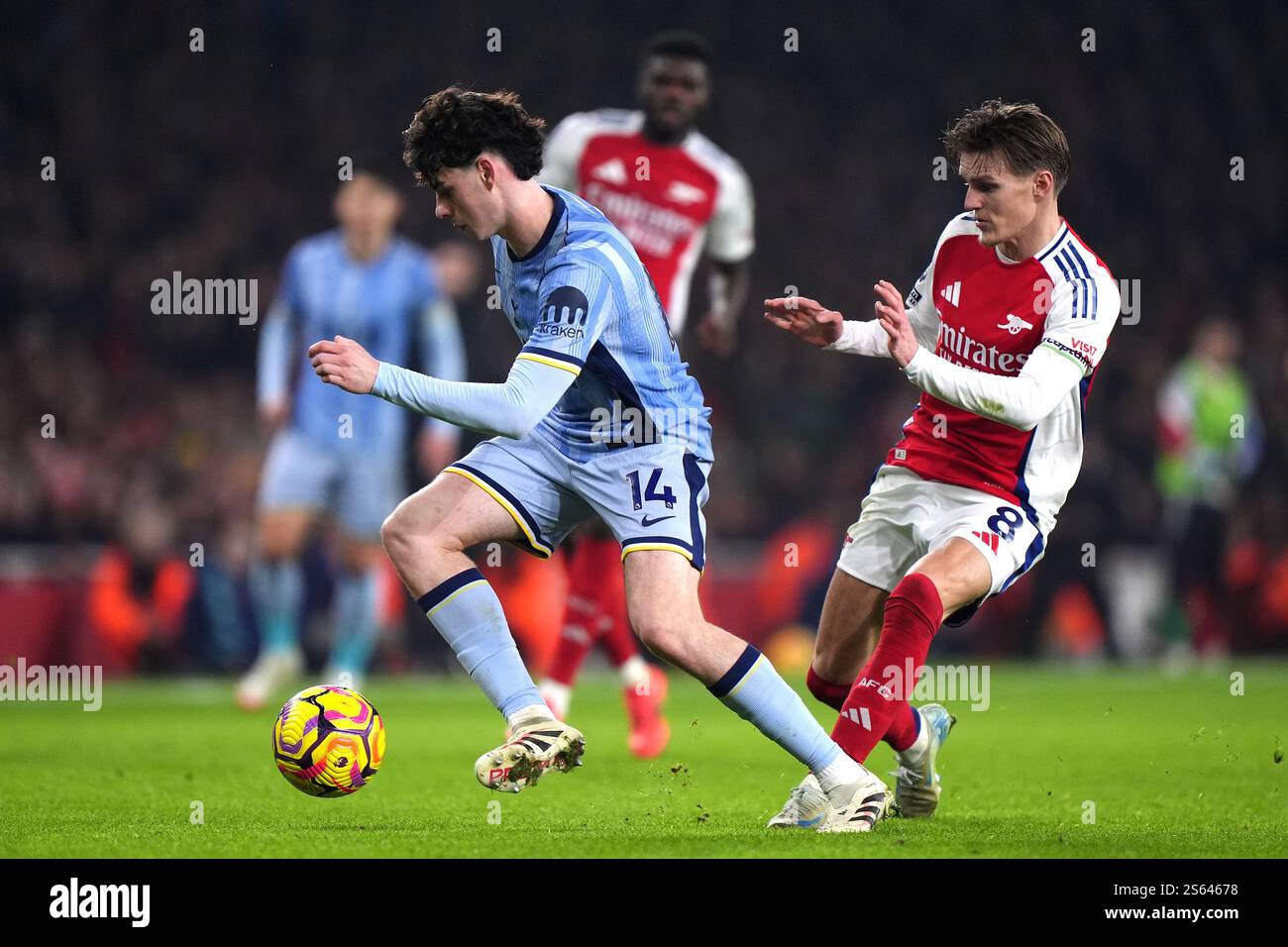 Tottenham Hotspur's Archie Gray (left) and Arsenal's Martin Odegaard ...