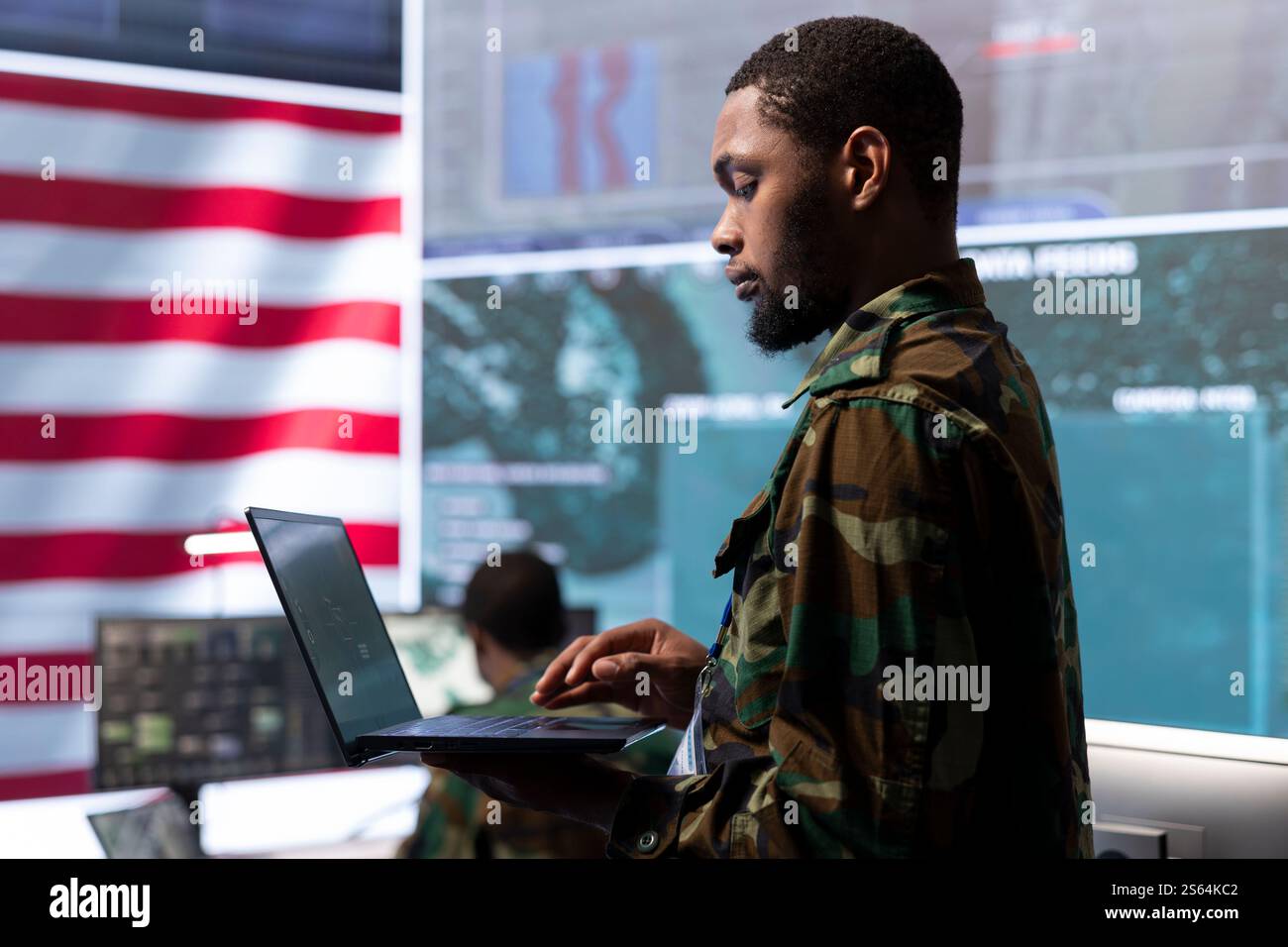 Military personnel in a control center operating advanced technology to ...