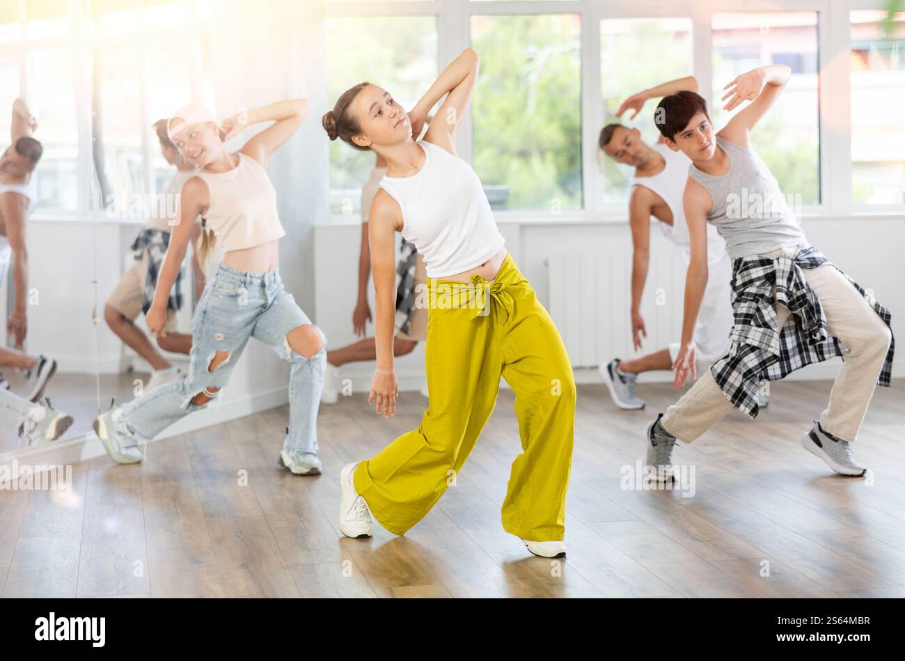 Teen Girl With Group Of Teenage Friends Learn To Dance Hip Hop Stock teen-girl-with-group-of-teenage-friends-learn-to-dance-hip-hop-stock