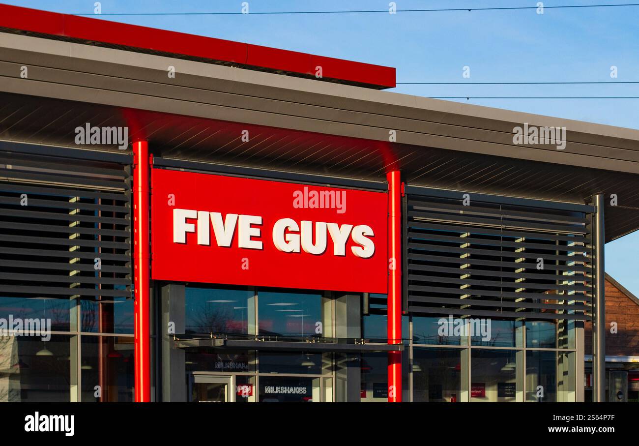 Exterior view of Five Guys fast food burger restaurant chain with red ...