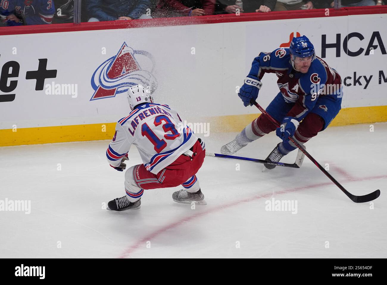 New York Rangers left wing Alexis Lafrenière (13) and Colorado Avalanche right wing Mikko
