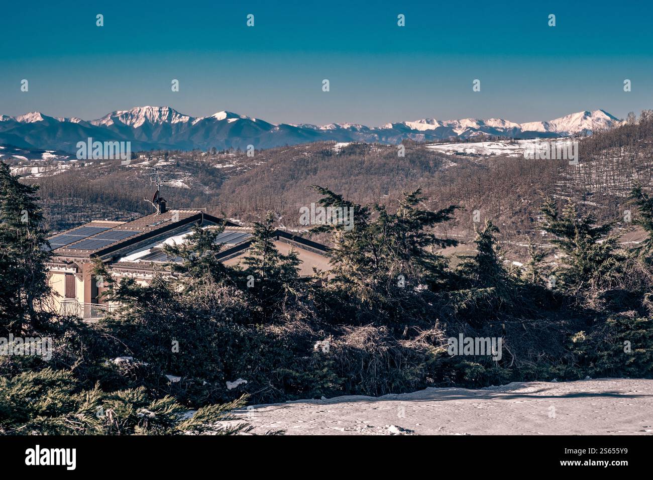 The main ridge of the Apennines: from Mt. Cimone to Mt. Corno alle Scale seen from the village of Monghidoro, Metropolitan City of Bologna, Emilia-Rom Stock Photo