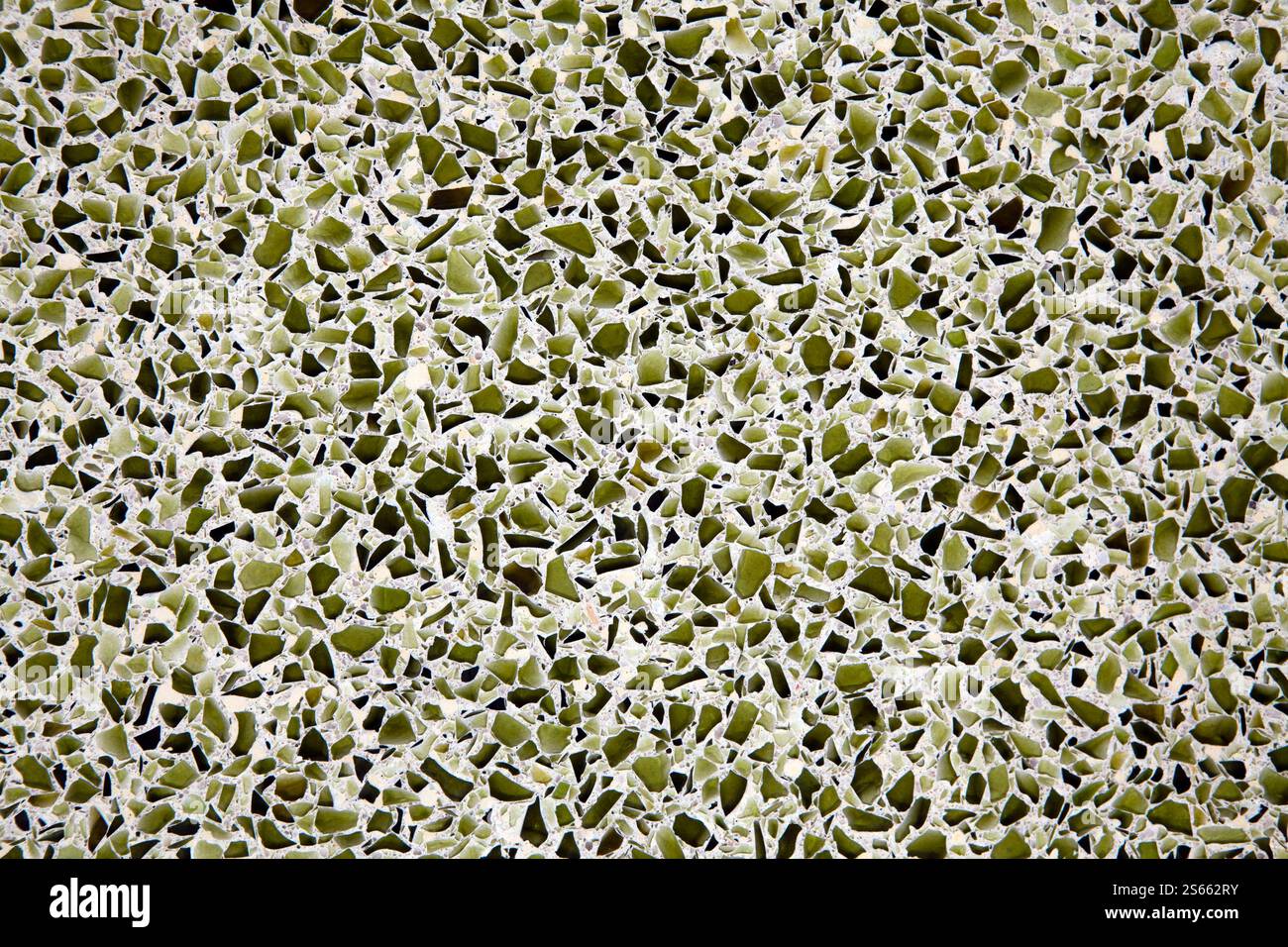 Broken recycled glass set in a concrete cement terrazzo flooring tile design. Stock Photo
