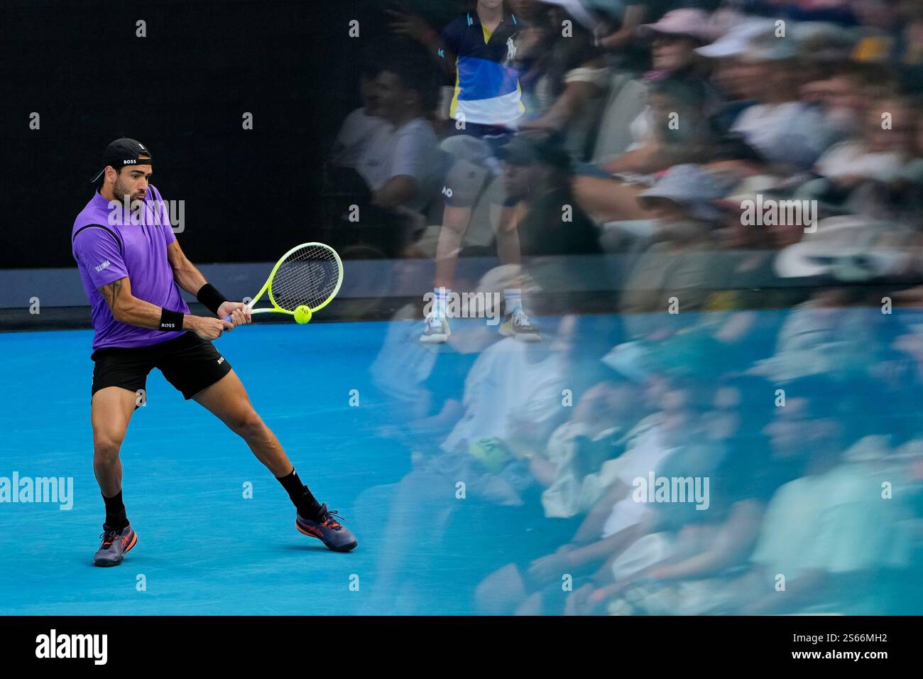 Matteo Berrettini of Italy plays a backhand return to Holger Rune of