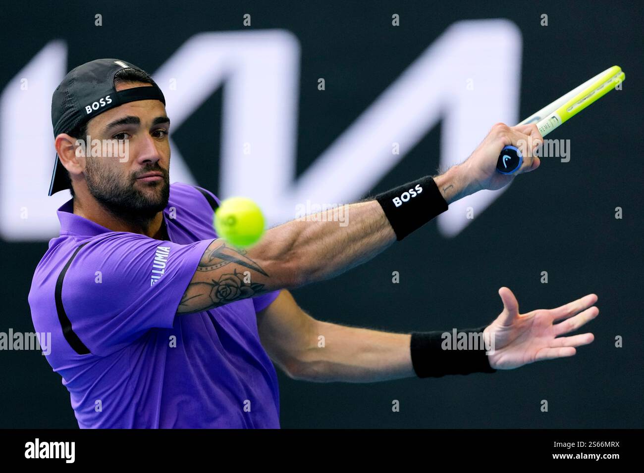 Matteo Berrettini of Italy plays a backhand return to Holger Rune of