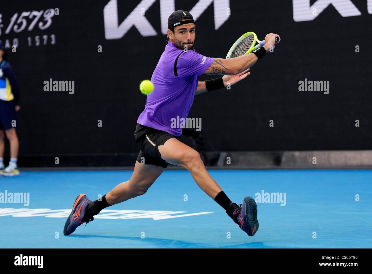 Matteo Berrettini of Italy plays a backhand return to Holger Rune of