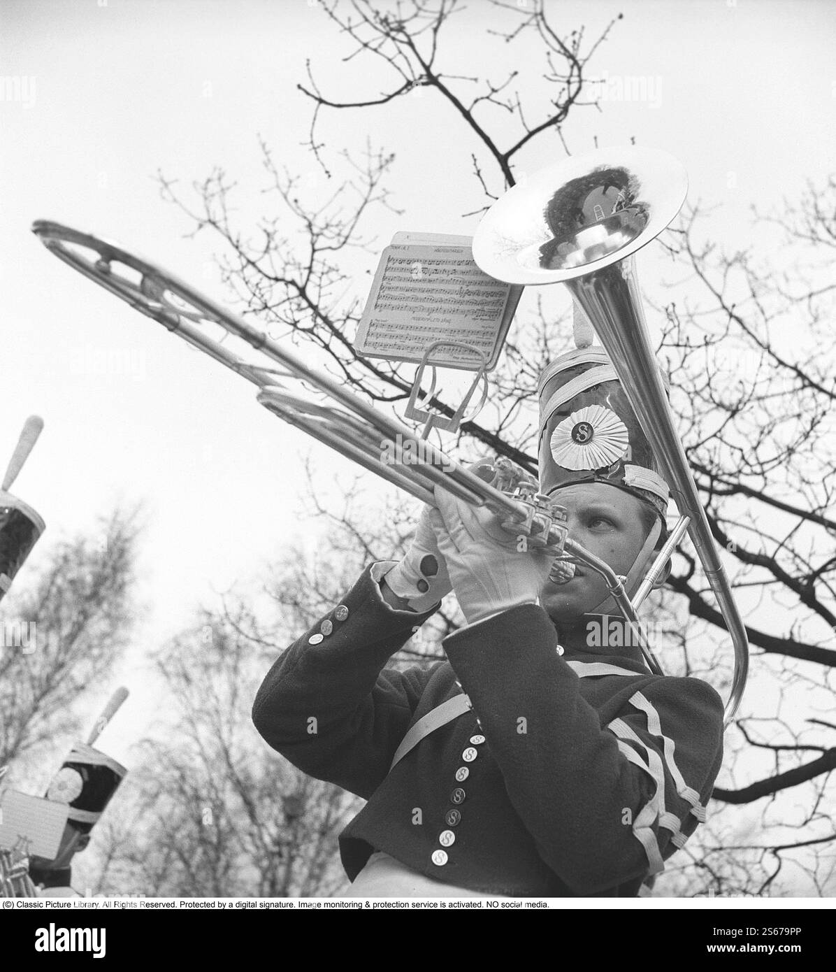 Children's guard parade 1940. Lennart Larsson parades and plays the valve trombone at Skansen in Stockholm on May 5, 1940. He is also called Lill-Lasse and is 11 years old.   May 1940. Kristoffersson ref 121-16 Stock Photo