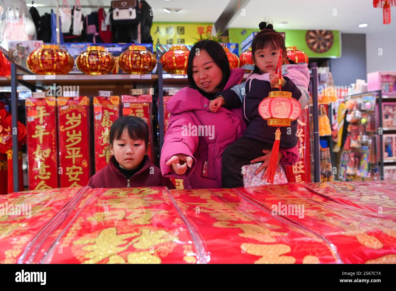 People select Spring Festival decorations in a market in Chongqing